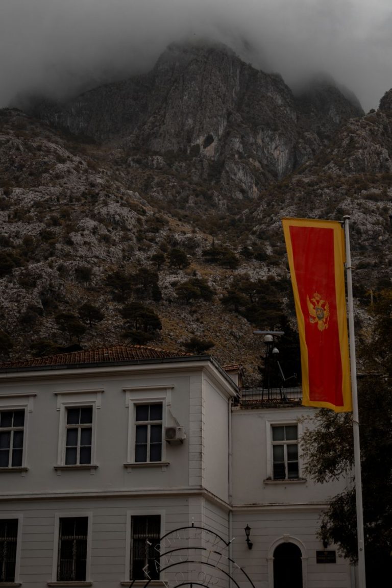montenegrin flag at the cloudy mountains